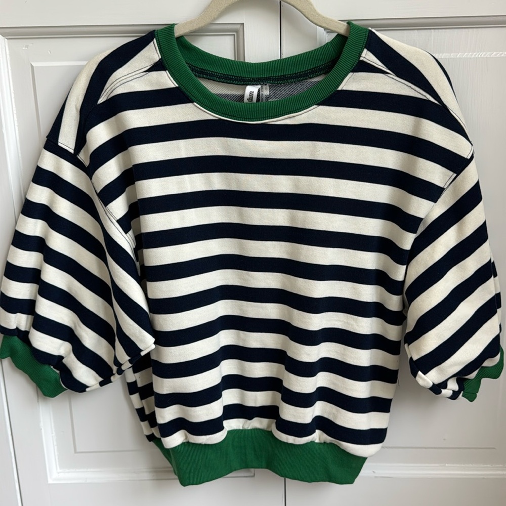 Short sleeve blue and white sweatshirt with green trim. Size S